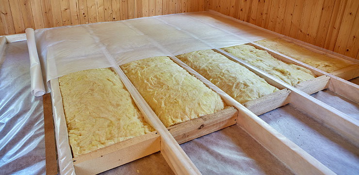 Yellow foam insulation in between wooden frame